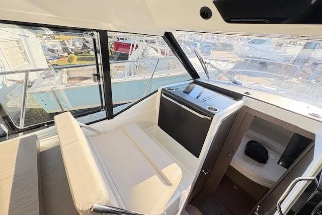 Slide: The Image of 2024 Jeanneau NC 895 Series 2 boat with spacious sunbathing deck and sleek design. - 7