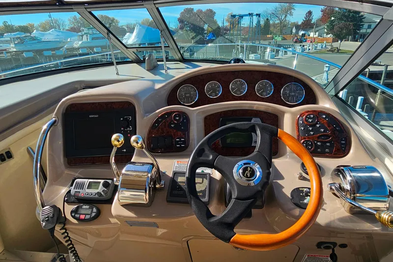 Slide: The Image of Simrad navigation system on 2004 Sea Ray 320 Sundancer boat dashboard. - 12