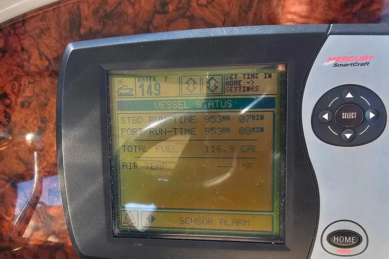 Slide: The Image of Control panel of a 2004 Sea Ray 320 Sundancer with radio and Clarion audio system. - 14