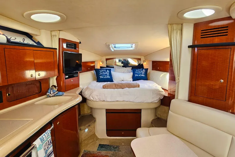 Slide: The Image of Luxurious interior of 2004 Sea Ray 320 Sundancer yacht with cozy seating and modern amenities. - 19