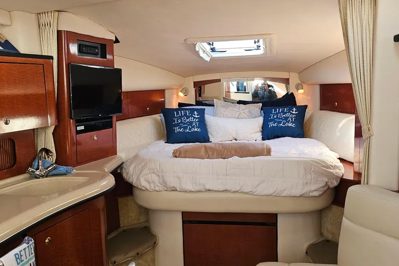 Slide: The Image of Luxurious interior of 2004 Sea Ray 320 Sundancer with plush seating and elegant decor. - 27