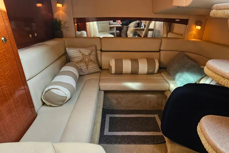 Slide: The Image of Control panel of a 2004 Sea Ray 320 Sundancer boat, featuring switches and a Fusion stereo. - 28