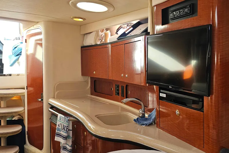 Slide: The Image of Luxurious interior of a 2004 Sea Ray 320 Sundancer yacht with elegant furnishings. - 30