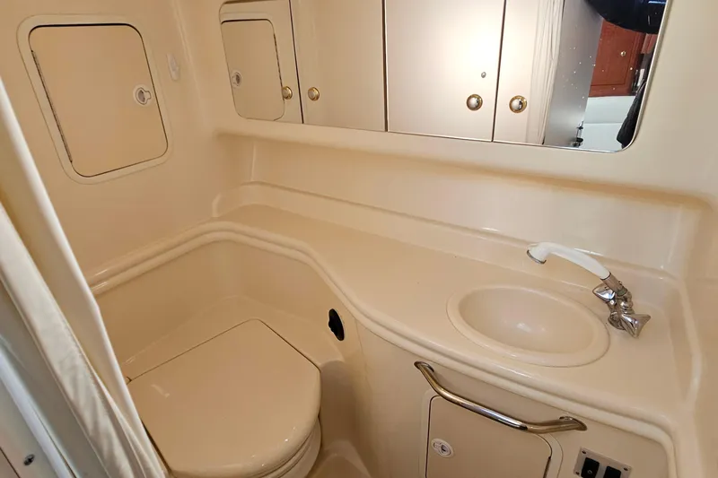 Slide: The Image of Engine compartment of a 2004 Sea Ray 320 Sundancer with twin MerCruiser 350 engines. - 32