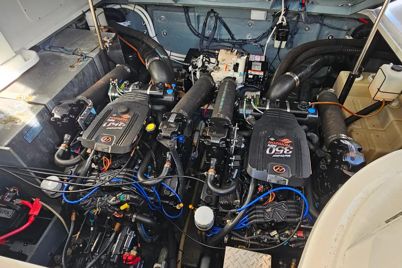 Slide: The Image of 2004 Sea Ray 320 Sundancer yacht on dry dock under clear blue sky. - 33