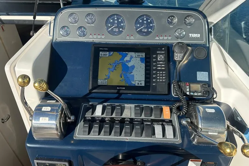 Slide: The Image of Helm of 2002 Tiara Yachts 2900 Coronet with navigation and control systems. - 11
