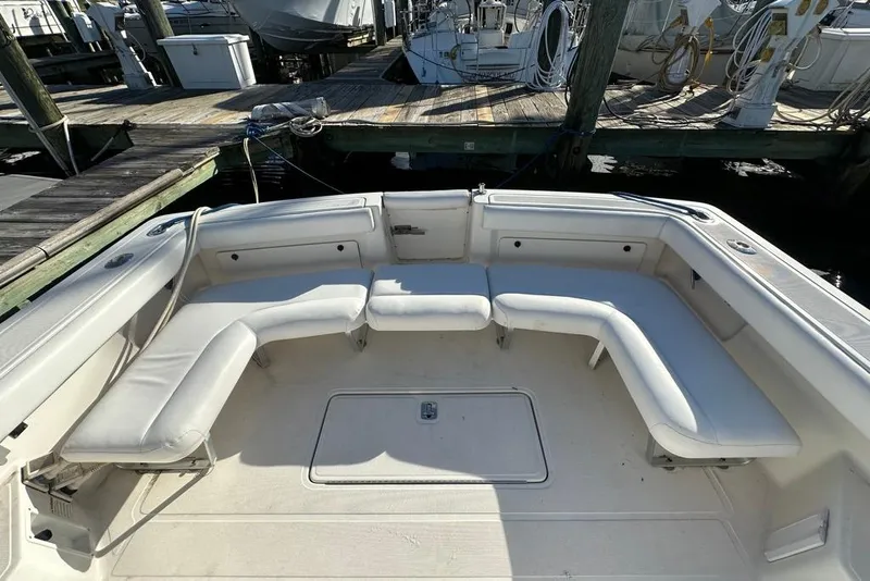 Slide: The Image of 2002 Tiara Yachts 2900 Coronet with spacious seating at the dock. - 15