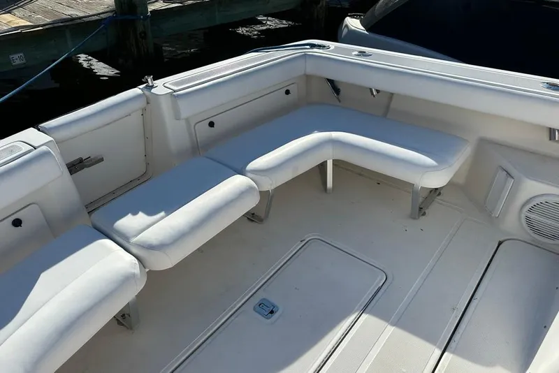 Slide: The Image of 2002 Tiara Yachts 2900 Coronet interior with white seating and deck. - 16