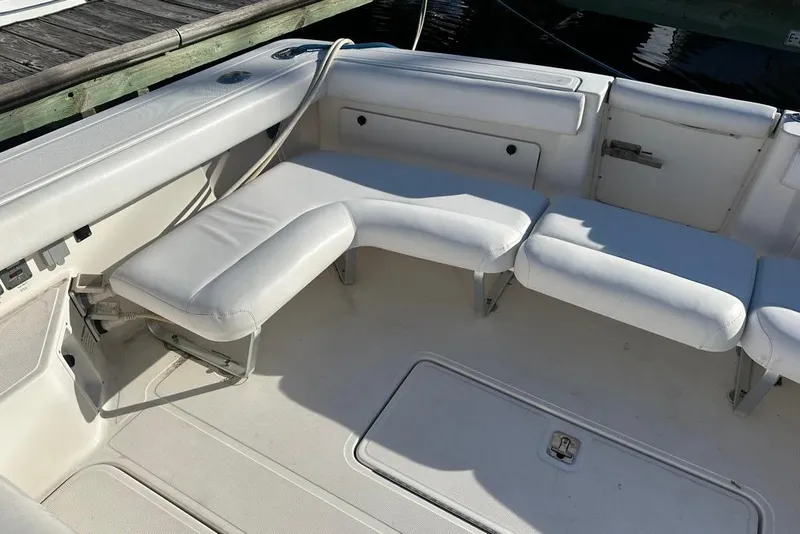 Slide: The Image of 2002 Tiara Yachts 2900 Coronet interior with white cushioned seating. - 17