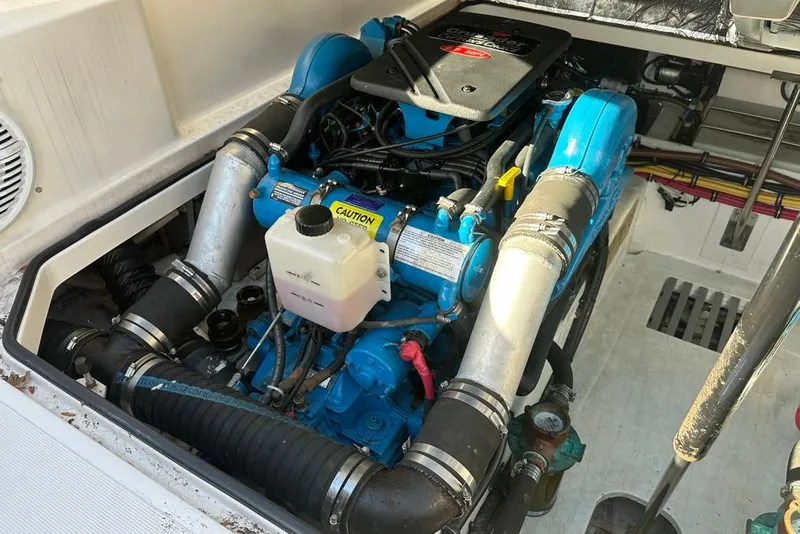 Slide: The Image of Engine compartment of a 2002 Tiara Yachts 2900 Coronet, showcasing detailed mechanical components. - 25