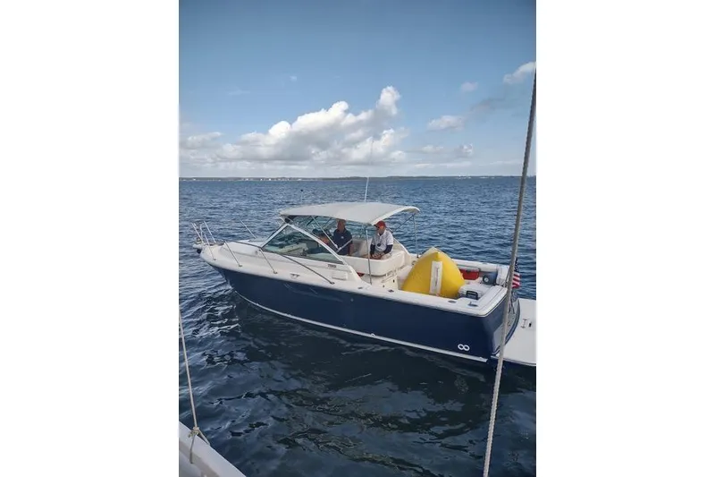 Slide: The Image of 2002 Tiara Yachts 2900 Coronet on open water under a clear sky. - 4