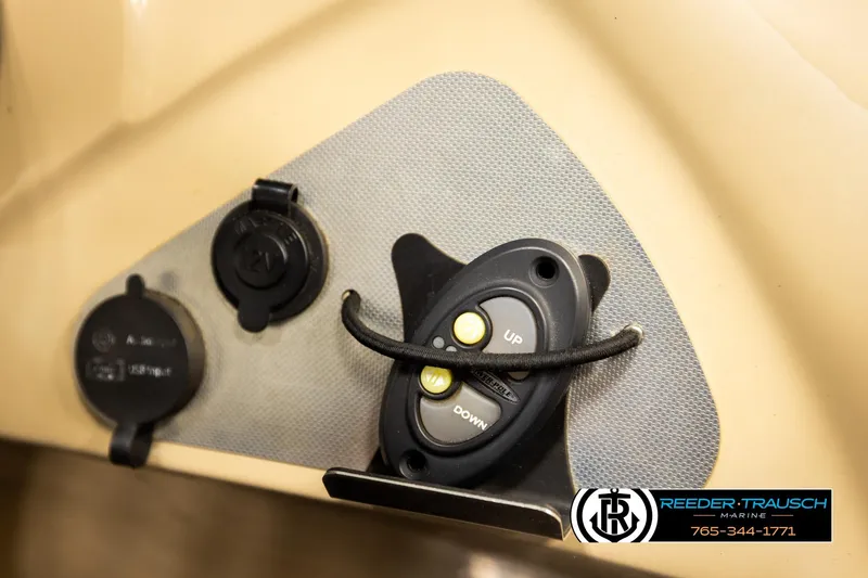 Slide: The Image of Control panel of a 2017 Manitou Oasis SHP boat with USB and 12V ports. - 41