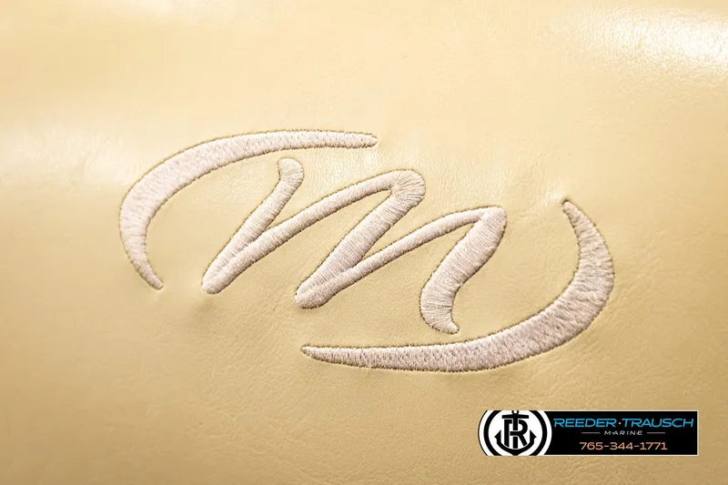 Slide: The Image of Embroidered logo on 2017 Manitou Oasis SHP boat seat, featuring Reeder-Trausch Marine branding. - 45