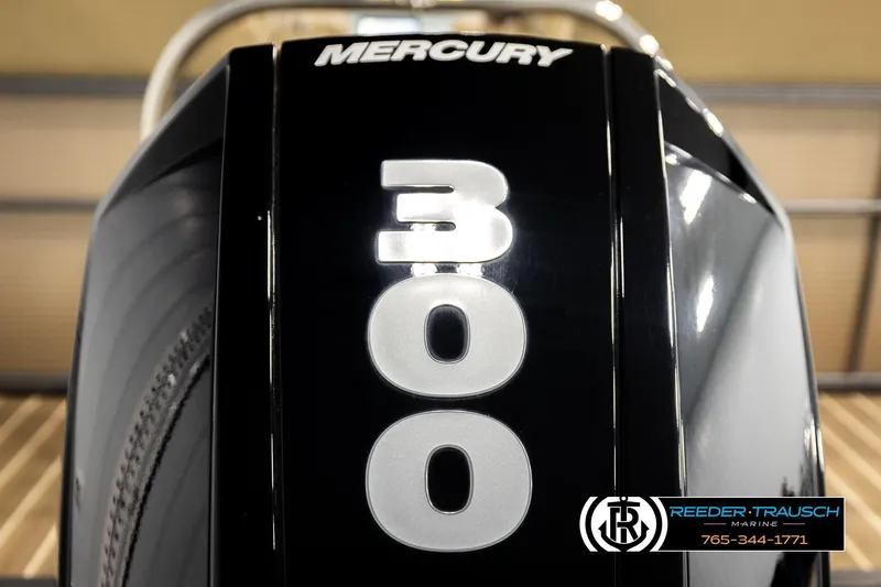 Slide: The Image of Mercury 300 outboard engine on 2017 Manitou Oasis SHP, Reeder-Trausch Marine branding. - 51