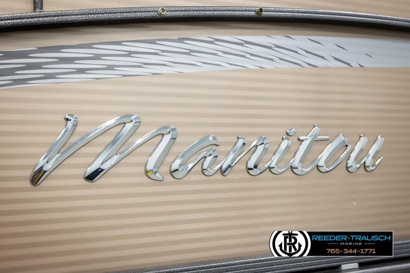 Slide: The Image of 2017 Manitou Oasis SHP logo on a beige background, featuring Reeder-Trausch Marine branding. - 58