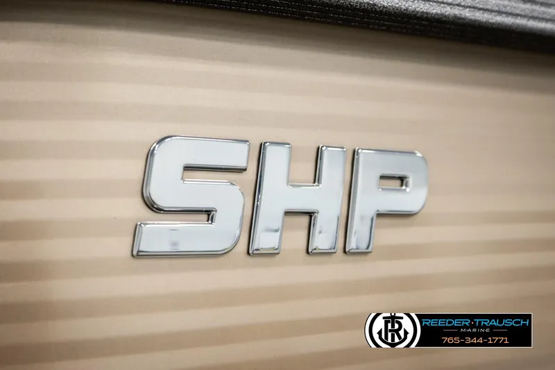 Slide: The Image of 2017 Manitou Oasis SHP logo on beige background, Reeder-Trausch Marine branding. - 59