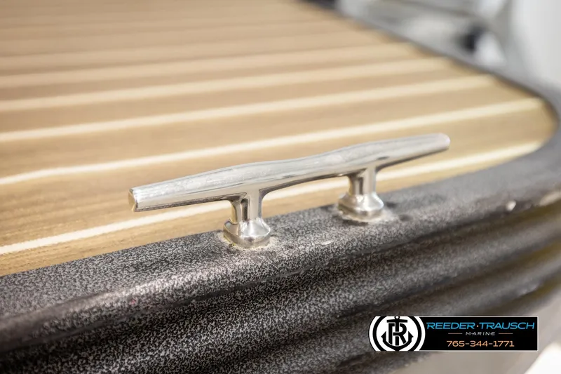 Slide: The Image of 2017 Manitou Oasis SHP boat cleat on textured deck surface. - 60
