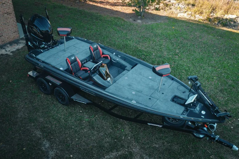 The Image of 2026 Phoenix 721 ZXL fishing boat on trailer, parked on grass. - 0