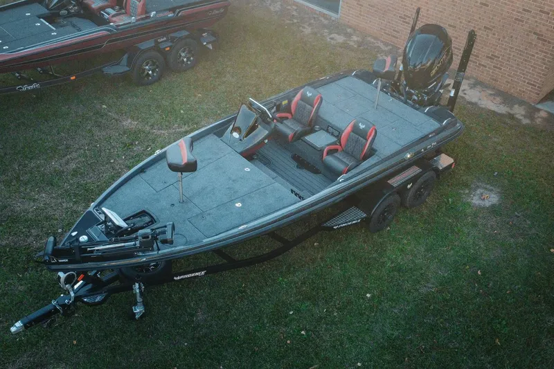 Slide: The Image of 2026 Phoenix 721 ZXL fishing boat on trailer, parked on grass. - 1