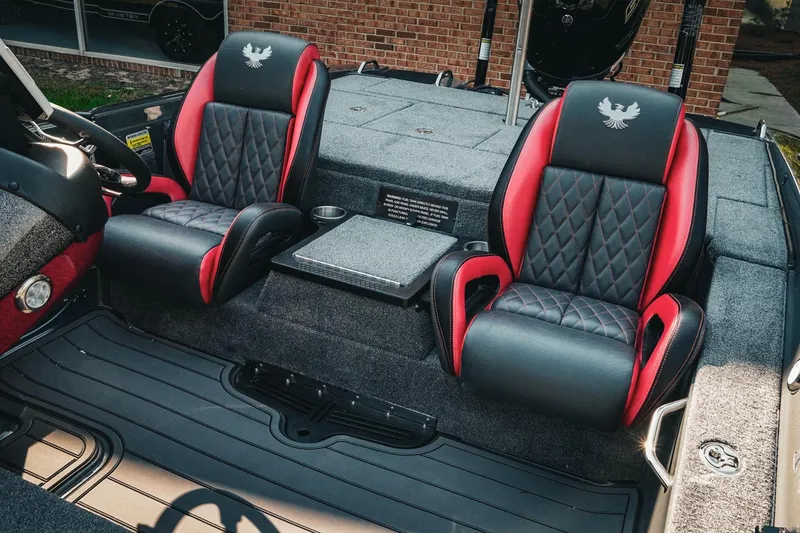 Slide: The Image of 2026 Phoenix 721 ZXL boat interior with black and red seats, diamond stitching. - 11