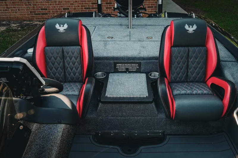 Slide: The Image of 2026 Phoenix 721 ZXL boat interior with red and black diamond-stitched seats. - 12