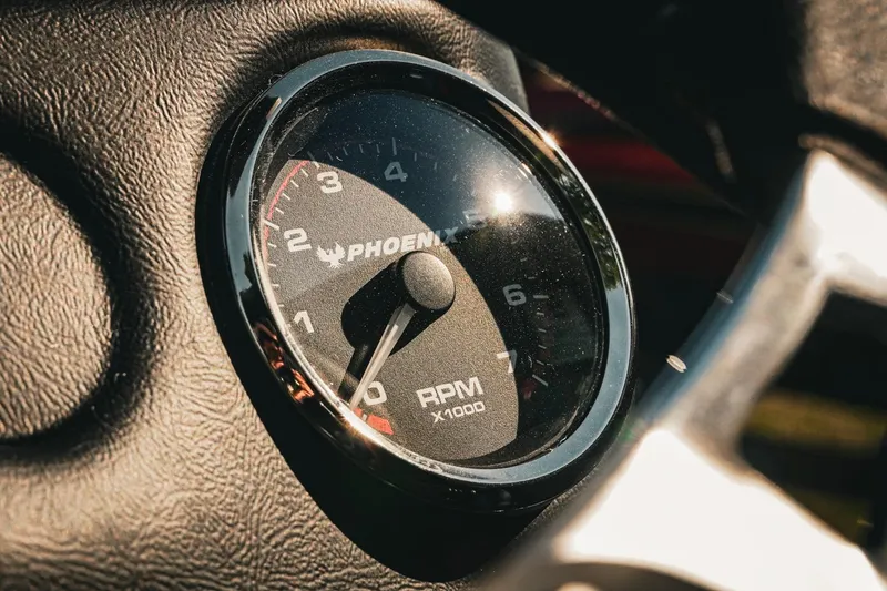 Slide: The Image of Close-up of 2026 Phoenix 721 ZXL tachometer, displaying RPM gauge in sunlight. - 18
