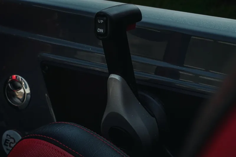 Slide: The Image of Close-up of 2026 Phoenix 721 ZXL control lever with "UP" and "DN" buttons. - 20