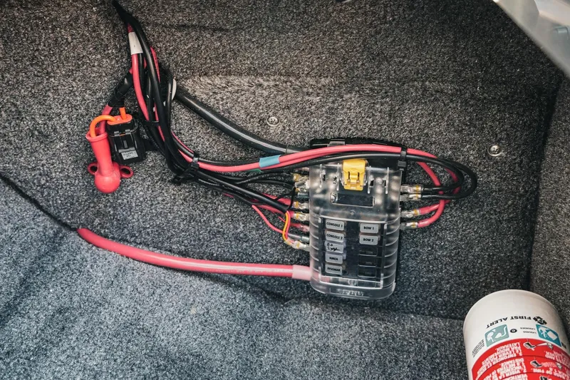 Slide: The Image of Electrical wiring and fuse box in 2026 Phoenix 721 ZXL boat interior. - 27