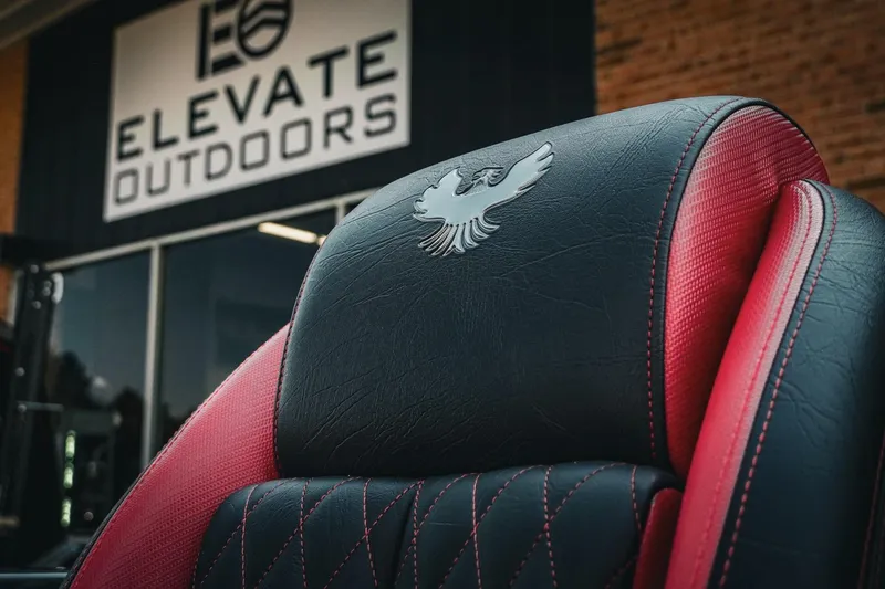 Slide: The Image of Luxurious Phoenix 721 ZXL seat with red accents, 2026 model, at Elevate Outdoors. - 28