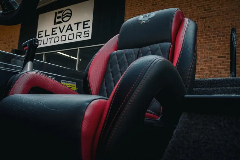 Slide: The Image of Luxurious black and red seat of 2026 Phoenix 721 ZXL boat at Elevate Outdoors. - 29