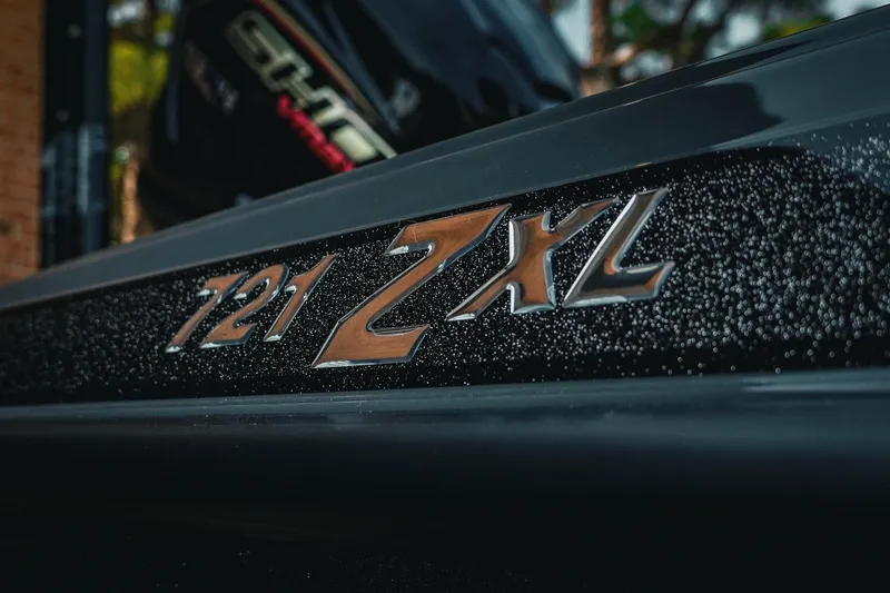 Slide: The Image of 2026 Phoenix 721 ZXL boat emblem with sleek metallic finish. - 35