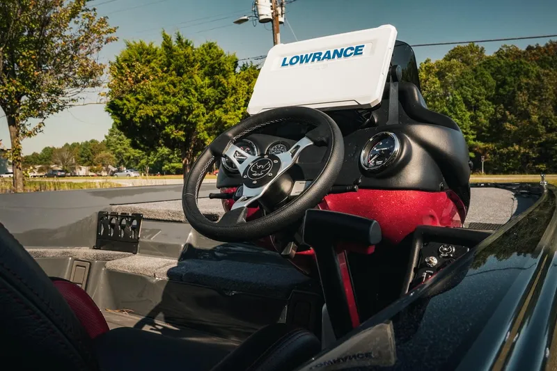 Slide: The Image of 2026 Phoenix 721 ZXL boat dashboard with Lowrance navigation system, steering wheel, and gauges. - 4