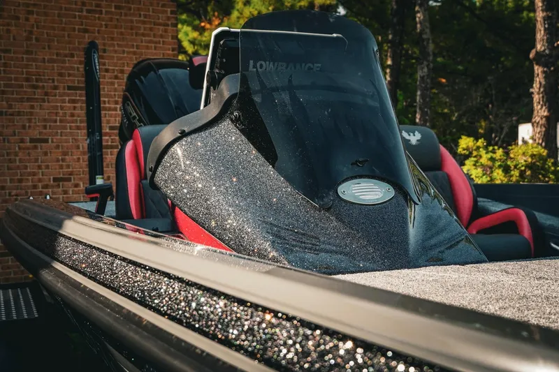 Slide: The Image of 2026 Phoenix 721 ZXL boat with sleek design and glittering finish, featuring red seats. - 43