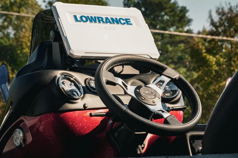 Slide: The Image of Steering wheel and dashboard of 2026 Phoenix 721 ZXL boat with Lowrance display. - 5
