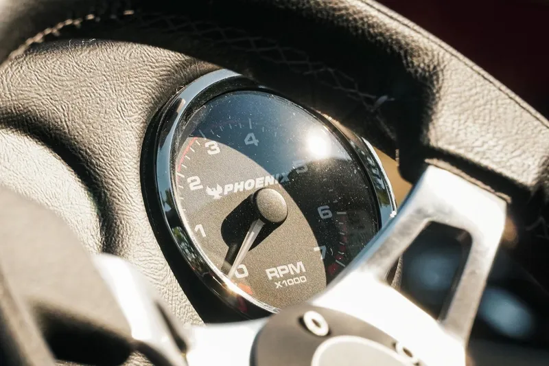 Slide: The Image of Close-up of 2026 Phoenix 721 ZXL tachometer, displaying RPM gauge on steering wheel. - 6