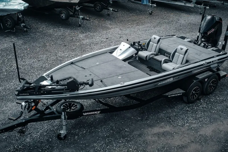 The Image of 2026 Phoenix 721 ZXL fishing boat on trailer, featuring Garmin equipment. - 1