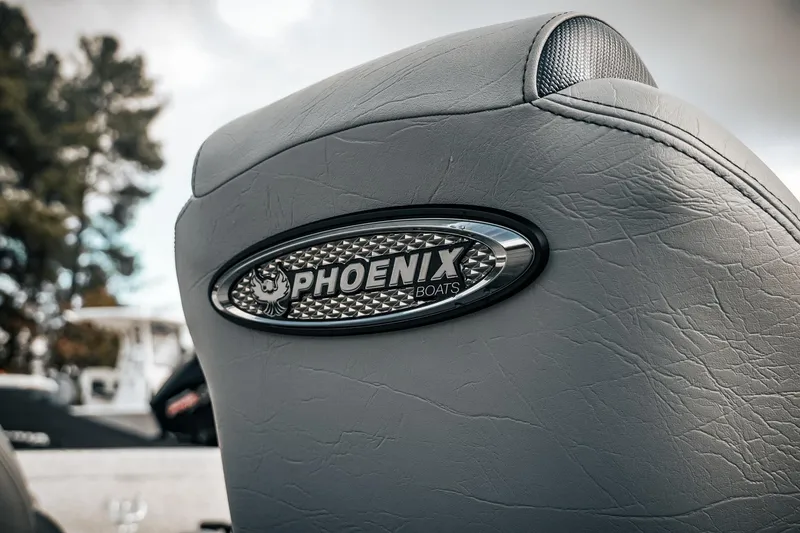 Slide: The Image of Close-up of 2026 Phoenix 721 ZXL boat seat with logo emblem. - 11
