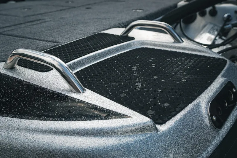 Slide: The Image of Close-up of 2026 Phoenix 721 ZXL boat deck with textured grip and metal handles. - 15