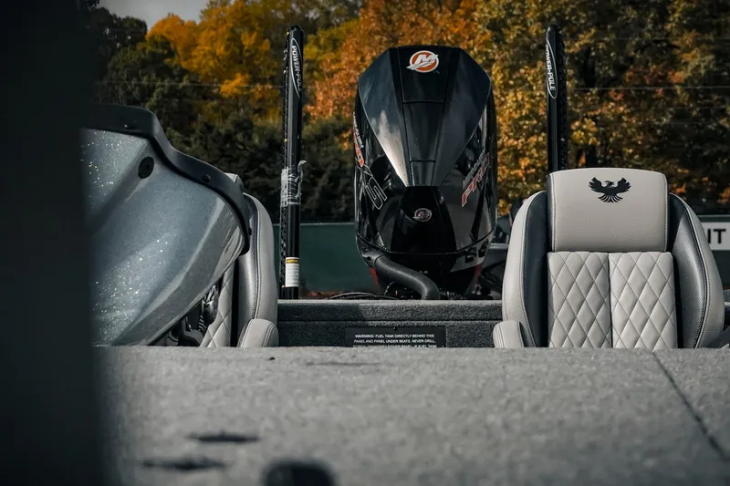 Slide: The Image of 2026 Phoenix 721 ZXL boat interior with engine and seats, autumn foliage background. - 20