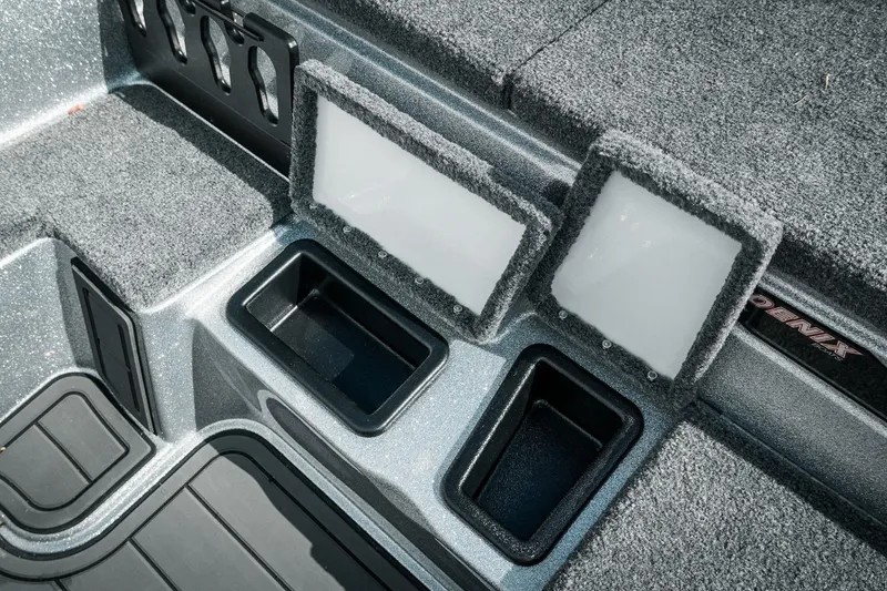 Slide: The Image of 2026 Phoenix 721 ZXL boat interior with storage compartments and carpeted surfaces. - 27