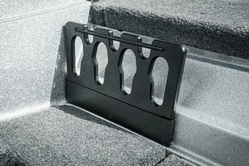 Slide: The Image of 2026 Phoenix 721 ZXL boat interior with rod holder on carpeted surface. - 31