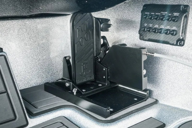Slide: The Image of 2026 Phoenix 721 ZXL boat throttle pedal and control panel close-up. - 34