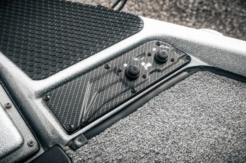 Slide: The Image of Control panel of 2026 Phoenix 721 ZXL boat with carbon fiber finish and textured flooring. - 37