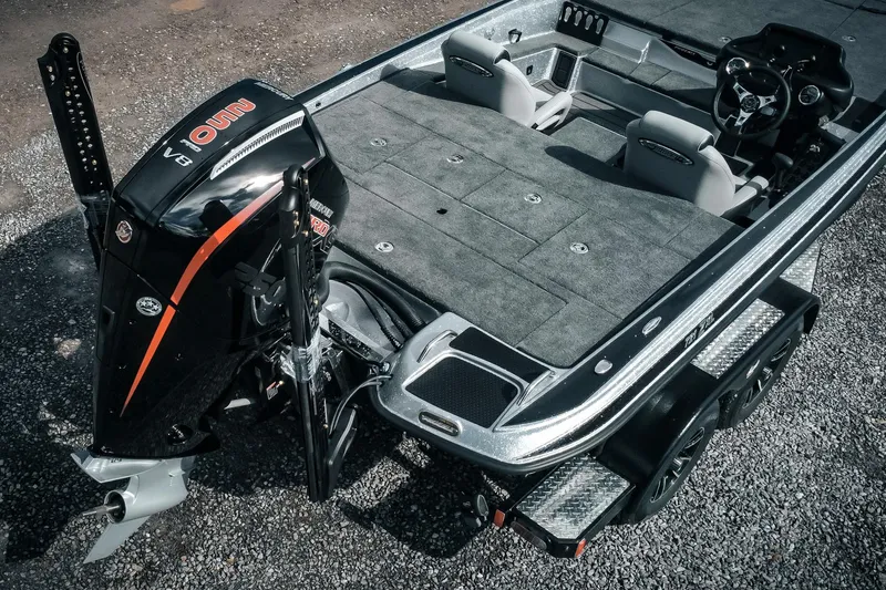 Slide: The Image of 2026 Phoenix 721 ZXL boat with powerful engine and spacious deck, parked on gravel. - 6