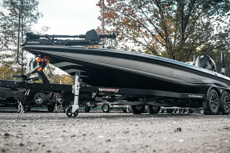 Slide: The Image of 2026 Phoenix 721 ZXL boat on trailer, featuring sleek design and Garmin equipment. - 7