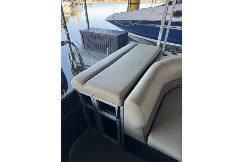 Slide: The Image of 2015 Crest 22 Crest I boat interior with beige seating and cup holders. - 12