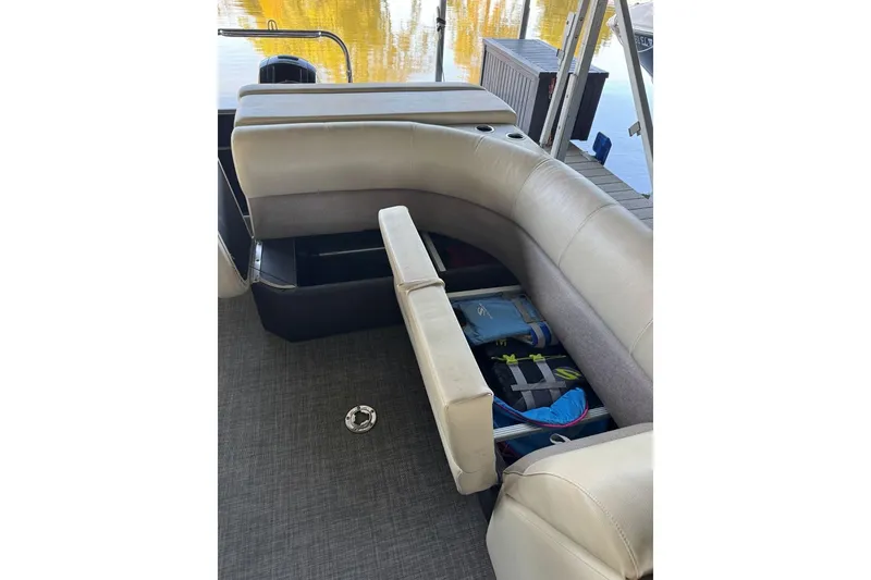 Slide: The Image of 2015 Crest 22 Crest I boat interior with open storage compartment and seating. - 14