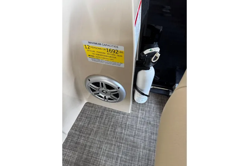 Slide: The Image of 2015 Crest 22 Crest I boat interior with capacity label and fire extinguisher. - 17