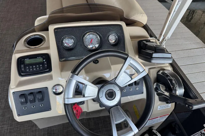 Slide: The Image of Steering console of 2015 Crest 22 Crest I boat with gauges and controls. - 18