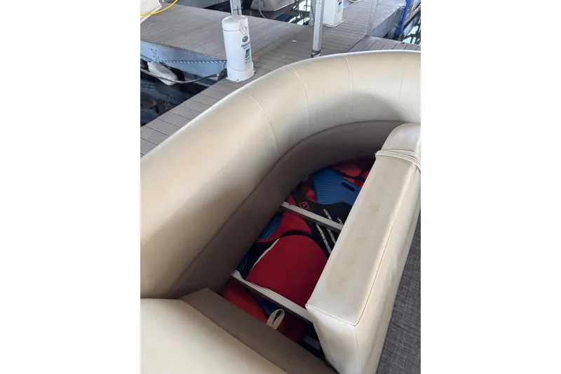Slide: The Image of 2015 Crest 22 Crest I boat interior with storage compartment and life jackets. - 22